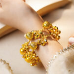 Gold Twisted Ghungroo Statement Bangles